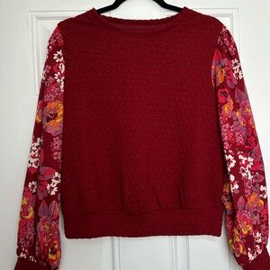 Anthropologie red top with floral pattern sleeves size small